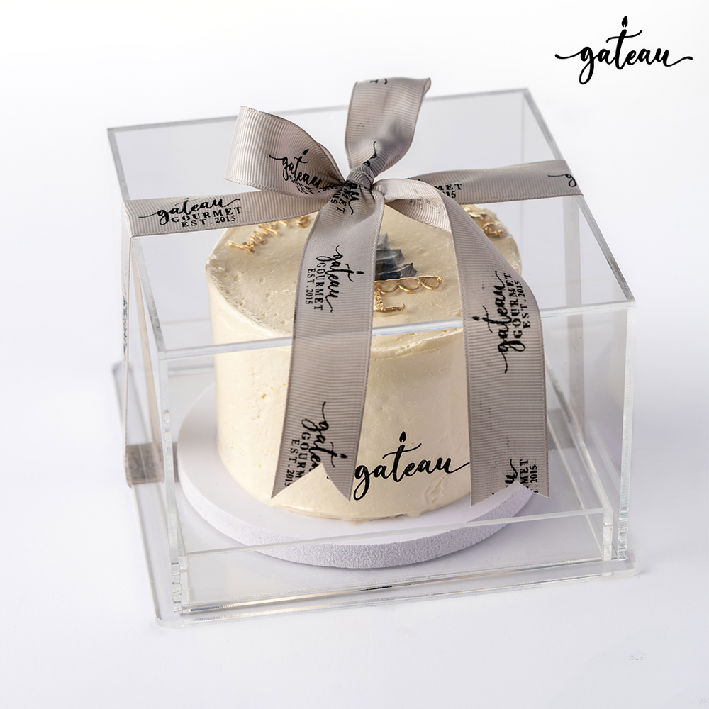 Gateau Gourmet Cafe elegant cake in clear box with branded ribbon showcasing unique birthday cake designs