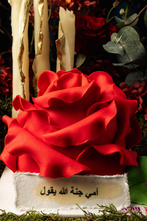 Unique Mother's Day floral cake by Gateau Gourmet Cafe with red rose design and decorative candles