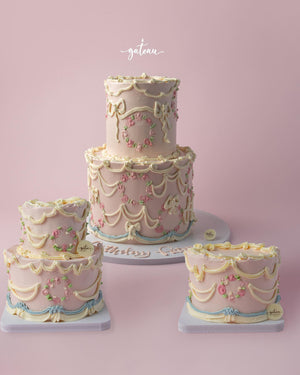 Elegant Vintage Buttercream Drape Cake with intricate floral decorations and pastel colors