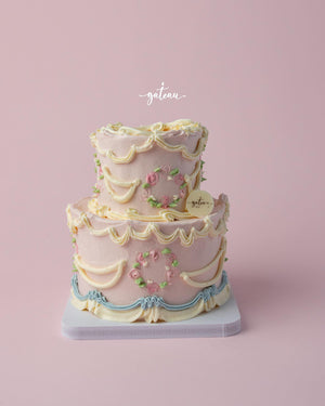 Elegant Vintage Buttercream Drape Cake decorated with floral accents from Gateau Gourmet Cafe