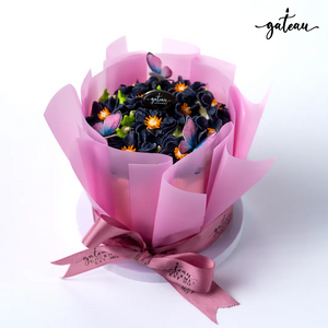 Violet Flowers in Bloom Cake Bouquet with colorful floral decorations and a pink ribbon from Gateau Gourmet Cafe