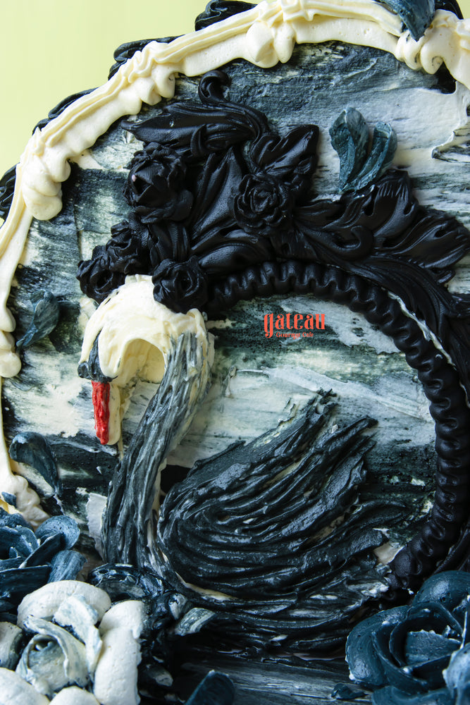 Elegant Gibbous cake for celebrations featuring intricate black and white swan design by Gateau Gourmet Cafe