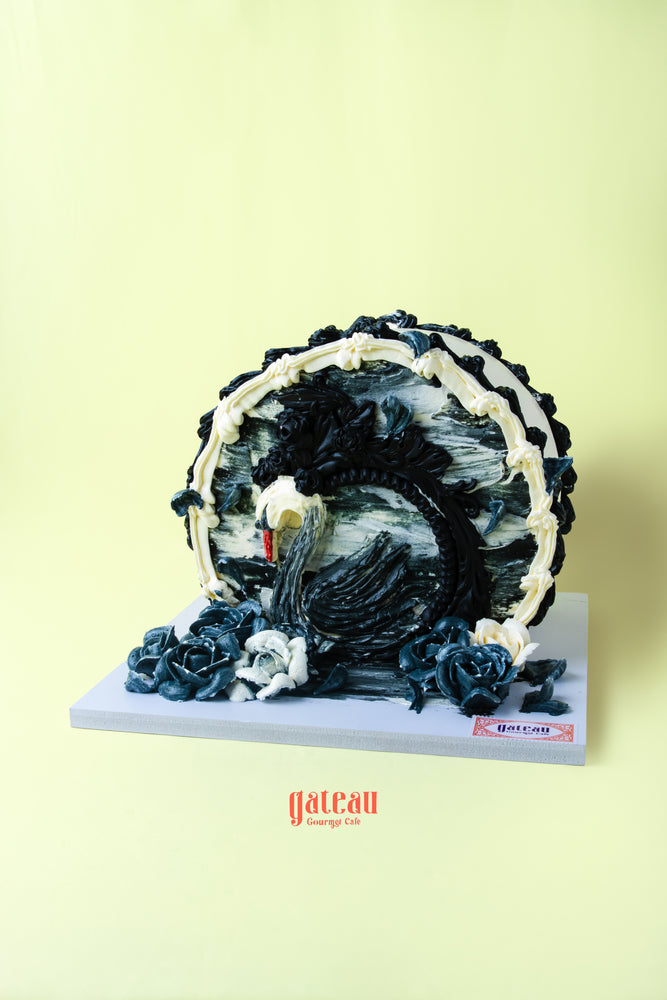 Exquisite gibbous cake for celebrations featuring intricate black and white decorations