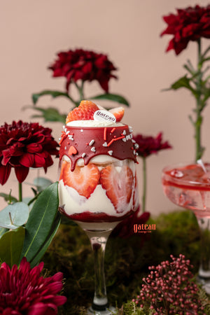 Delicious goblet cake arrangement with strawberries and creamy layers, presented at Gateau Gourmet Cafe