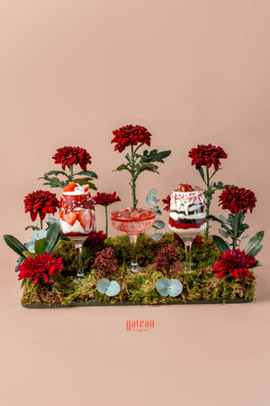 Beautiful goblet cake arrangement featuring vibrant flowers and delicious layered desserts displayed elegantly