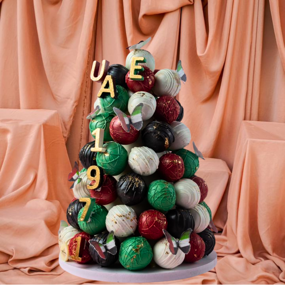 Colorful gourmet chocolate truffle tower with decorative accents for special occasions