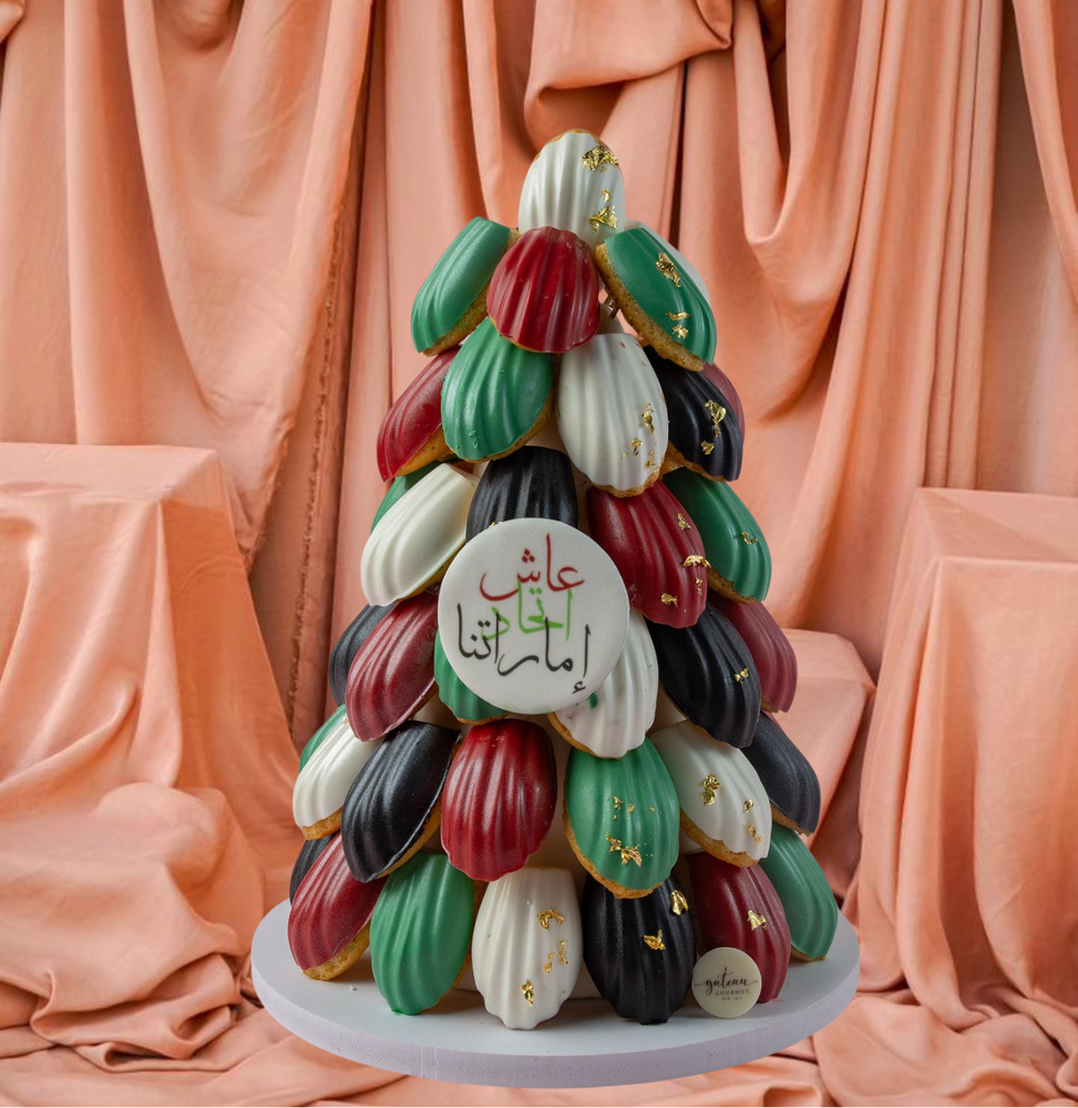 Elegant gourmet madeline dessert arranged in a festive tree shape, vibrant colors and decorative accents