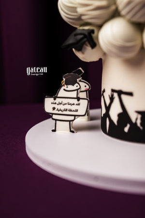 Graduation themed cake with round treats made from moist cake sponge, featuring decorative toppers