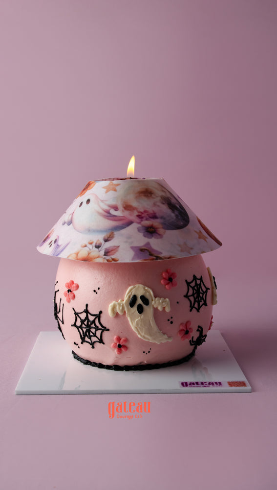 Halloween lamp cake by Gateau Gourmet designed with ghost and flower decorations for festive occasions