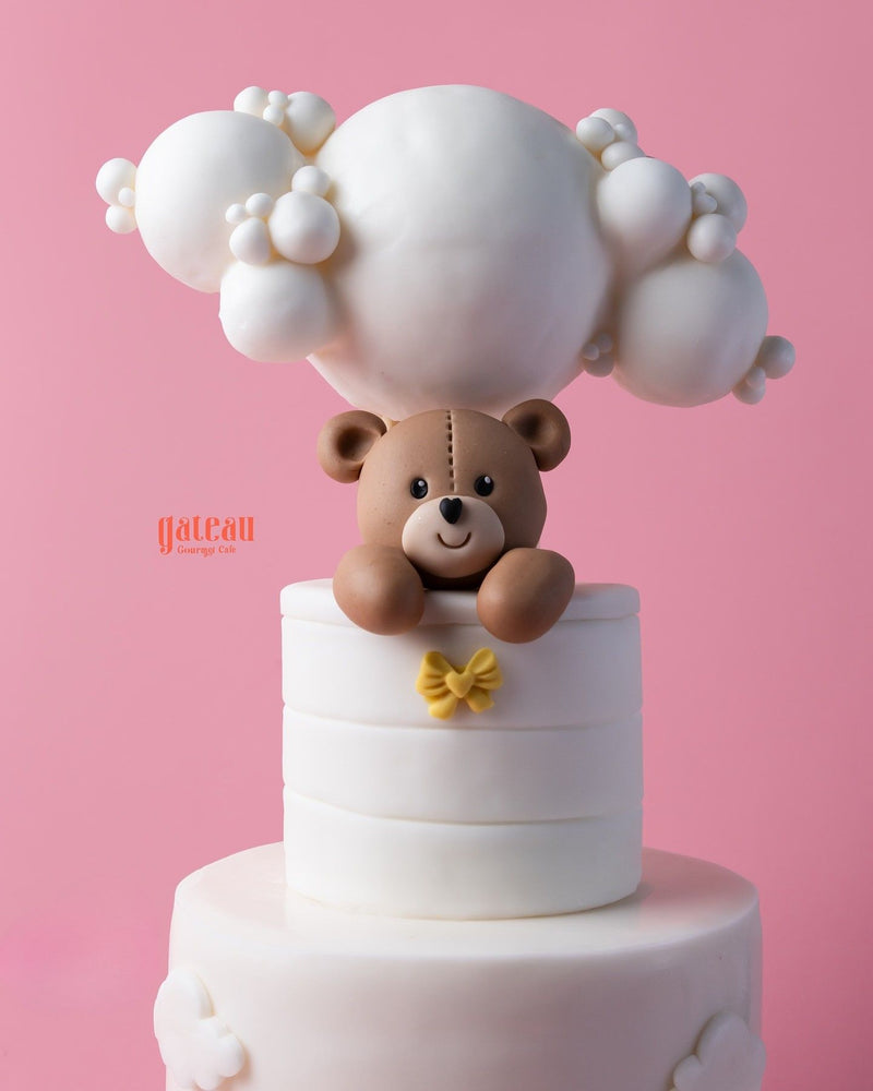Hello teddy bear cake from Gateau Gourmet Cafe with a playful bear and whimsical clouds design