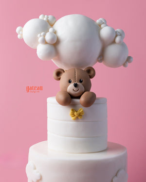 Hello teddy bear cake from Gateau Gourmet Cafe with a playful bear and whimsical clouds design
