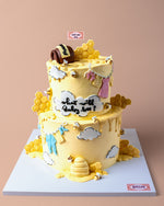 Honey Bee Themed Cake with honeycomb design and cute decorations for celebrations