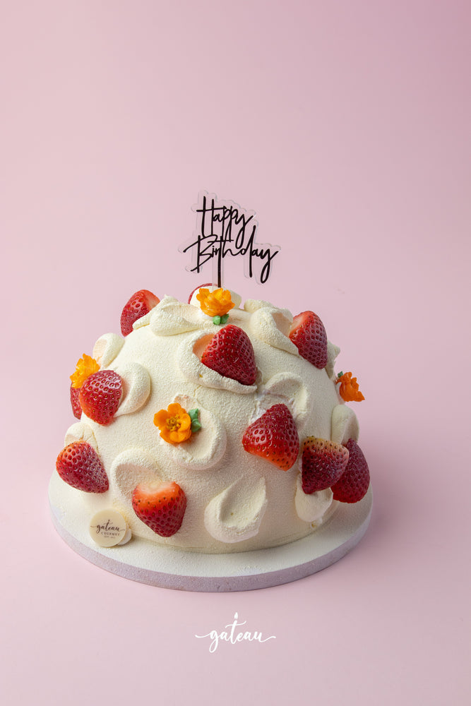 Ice Mountain Strawberry Cake decorated with fresh strawberries and a Happy Birthday topper