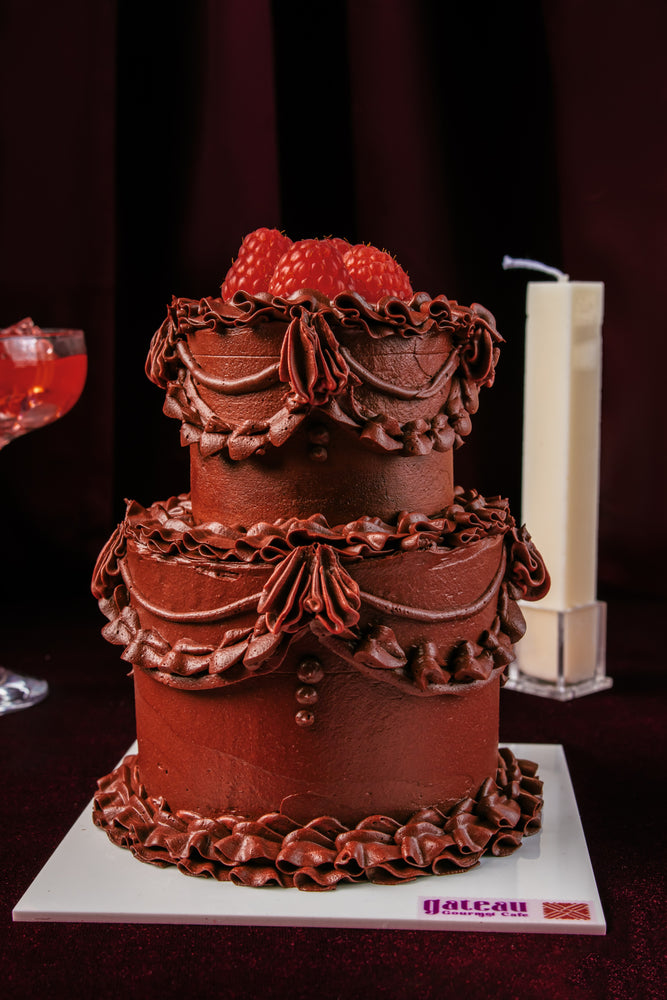 Lace Classic Mini Cake With Candle decorated with chocolate icing and topped with fresh raspberries