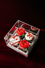 Beautiful Love On Cup Cake display featuring red rose designs and sweet decorations in a clear box