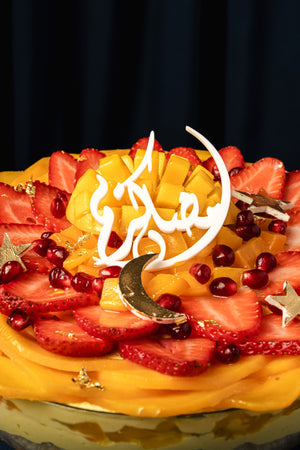 Gourmet mango fruit bowl dessert with fresh mango, strawberries, and decorative toppings from Gateau Gourmet Cafe
