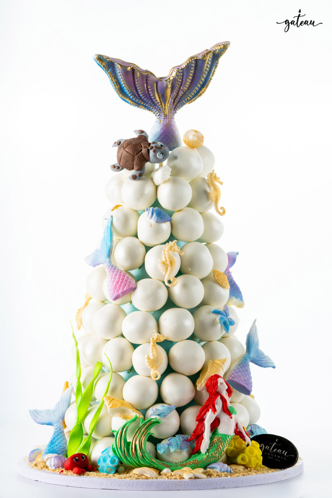 Gateau Gourmet Cafe donut cake decorated with colorful mermaid theme cake toppers and sea creatures