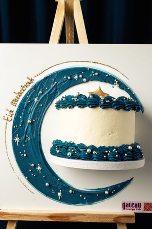 Elegant mini-canvas-cake decorated with blue frosting and star accents for celebrations