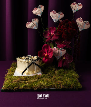Mini Heart Black & White Graduate Cake Design with Arrangement featuring floral accents and decorations.