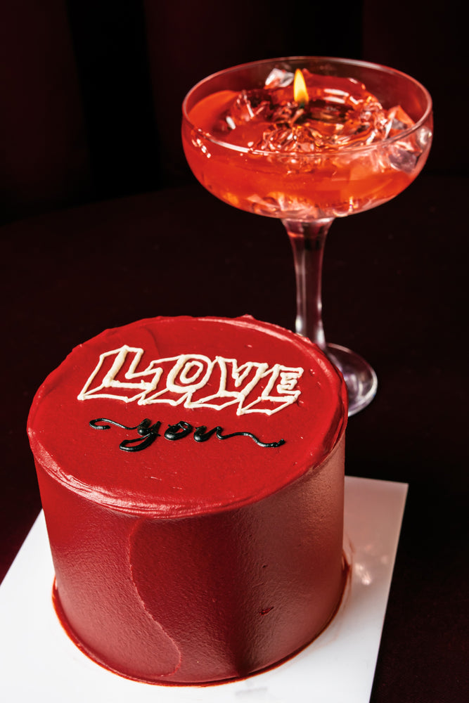 Mini Love Red Cake With Candle featuring rich red frosting and a chocolate message for special celebrations