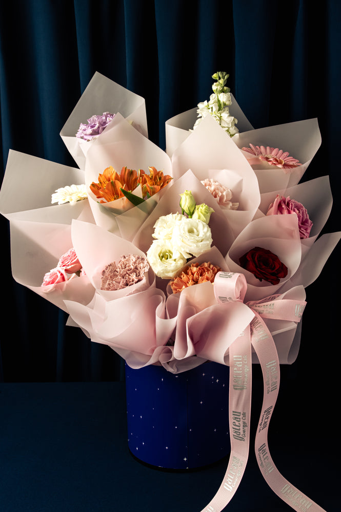 Beautiful Mothers Day Flower Bouquet with various colorful flowers arranged elegantly in a decorative vase