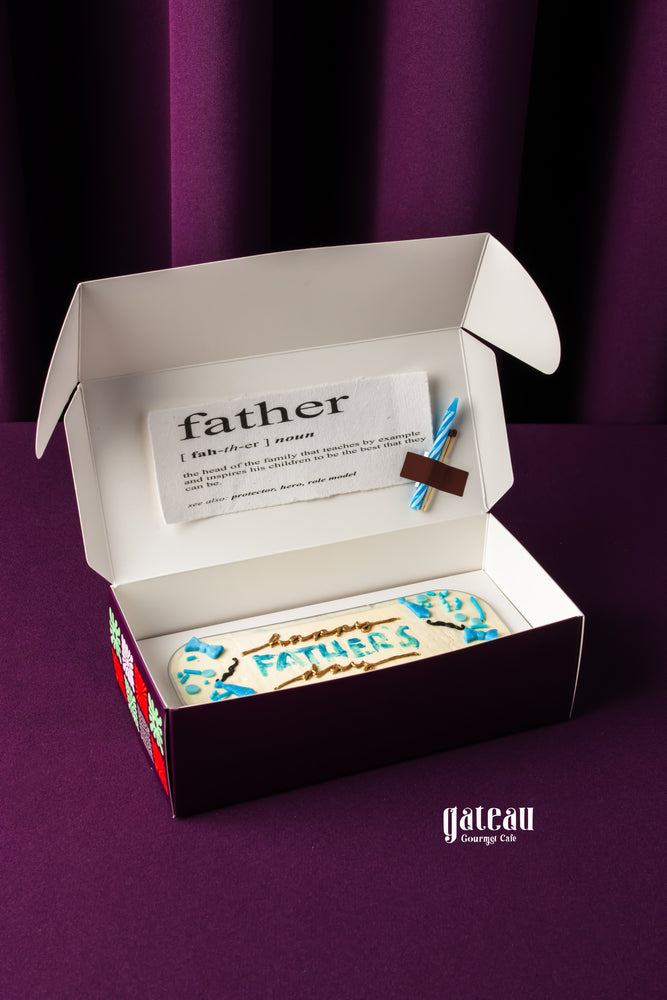Father's Day loaf cake from Gateau Gourmet Cafe in decorative box with blue icing and celebratory design
