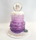 Ombre Classy Graduate Cake Design in purple with decorative topper for graduation celebrations