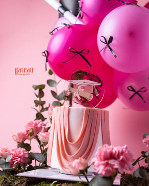 Elegant Pink & White Graduate Cake Design with Arrangement and balloons for graduation celebrations