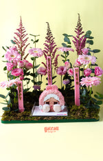 Gateau Gourmet Cafe Powerpuff Girls themed dessert cake with pink floral decorations and birthday candles