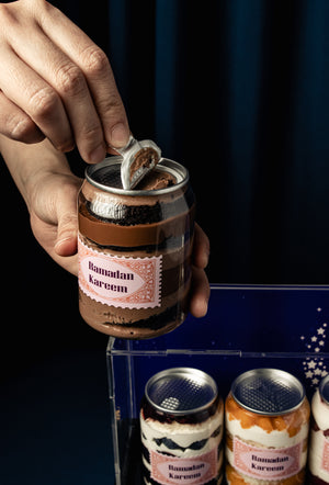 Gateau Gourmet Cafe homemade gourmet canned cake in jar with Ramadan Kareem label being opened