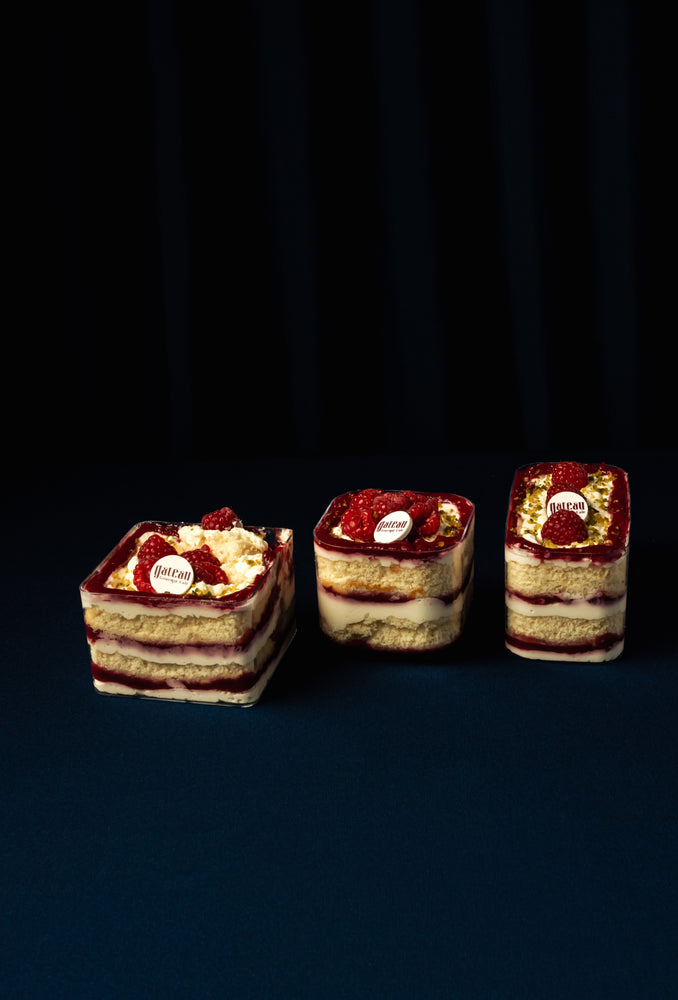 Three delicious Raspberry Fruit Treats layered with cream and cake from Gateau Gourmet Cafe