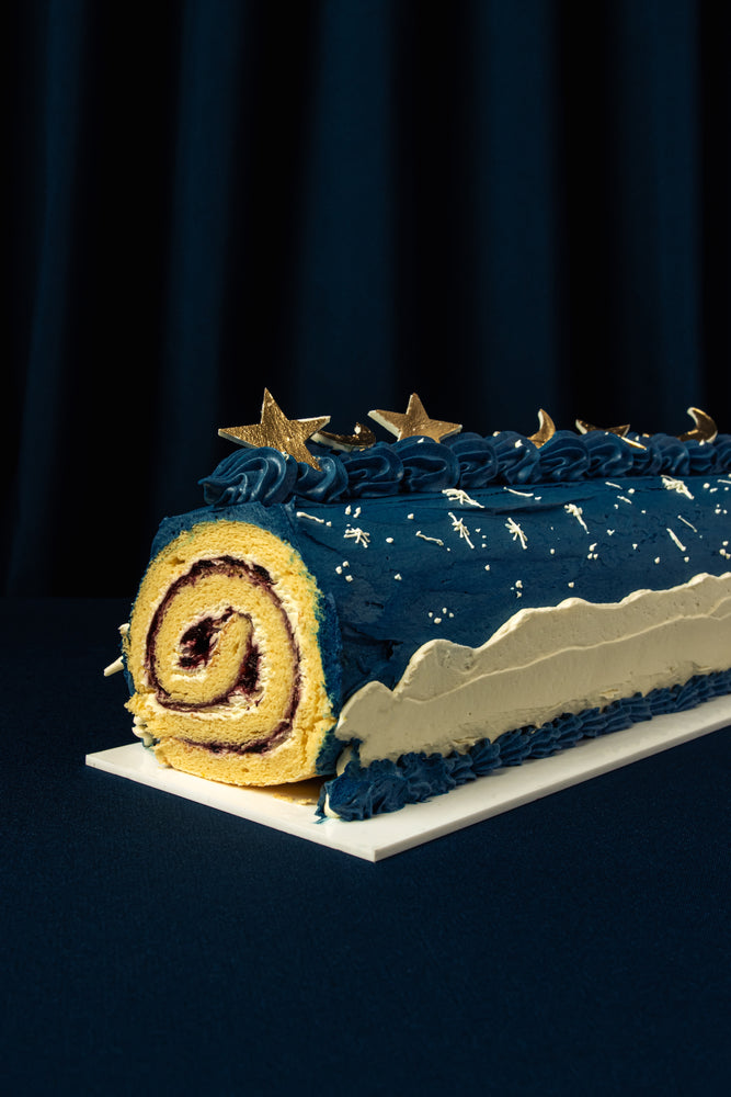 Sky Canvas Ramadan Roll Cake decorated with stars and a blue frosting for festive celebrations