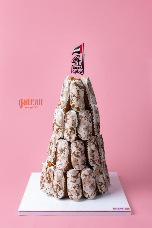 Soldier theme eclair tower decorated with a United Arab Emirates flag and a festive design by Gateau Gourmet Cafe