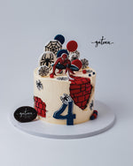 Spiderman-theme-cake from Gateau Gourmet Cafe with vibrant decorations and a superhero figurine