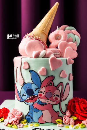 Gateau Gourmet Cafe Stitch and Angel Theme Cake with colorful heart decorations and an upside-down ice cream cone on top