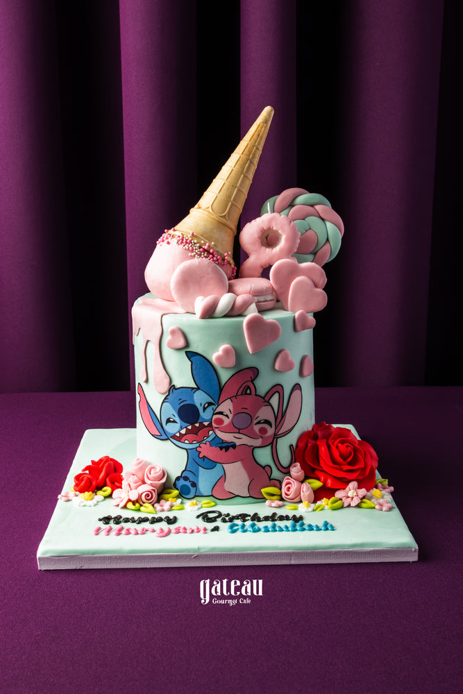 Gateau Gourmet Cafe Stitch and Angel Theme Cake with colorful decorations and ice cream cone topper