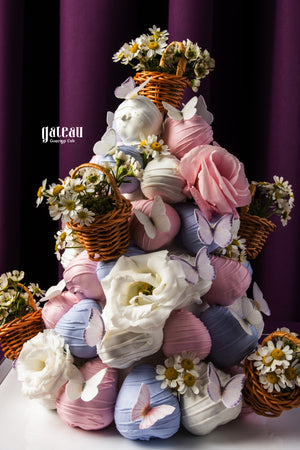 Elegant strawberry tower cake decorated with flowers and butterflies in pastel colors from Gateau Gourmet Cafe