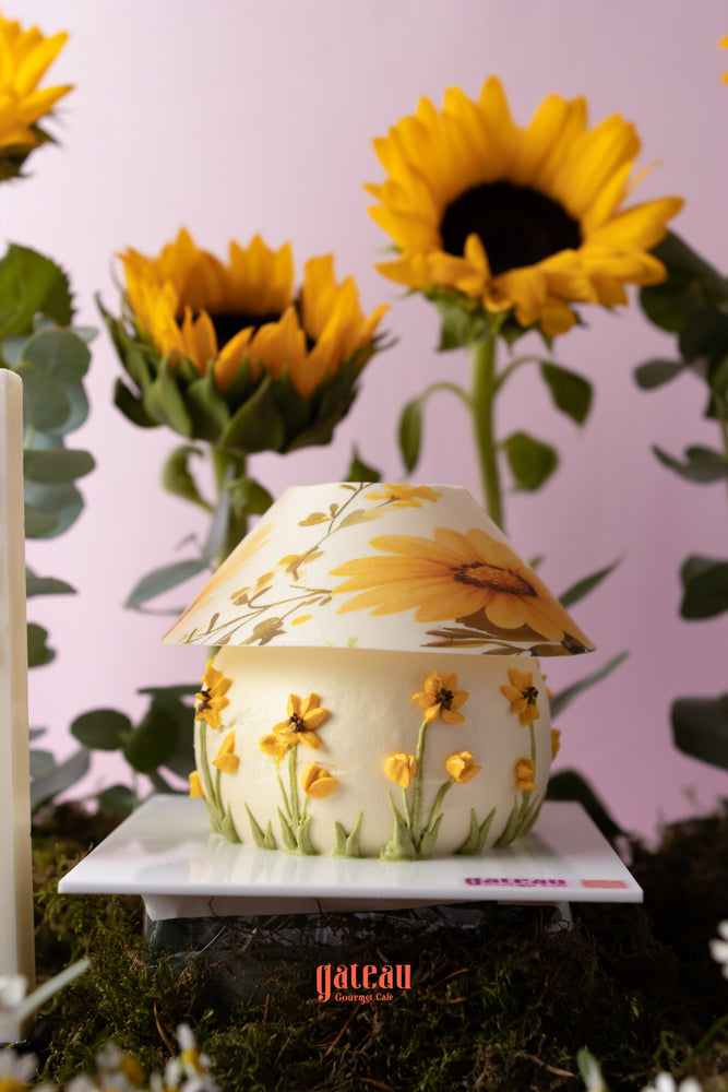 Beautiful sunflower cake arrangement from Gateau Gourmet Cafe with floral decoration and vibrant sunflowers