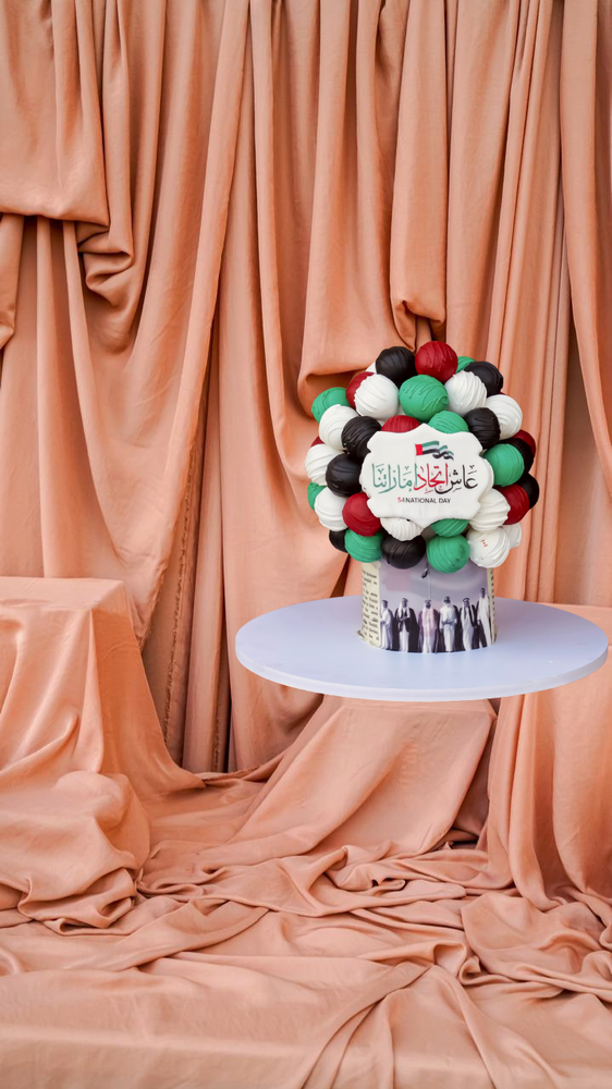 Artistic Sweet Dessert I7tifal Cake Decorated with Colorful Gourmet Balls on a White Stand