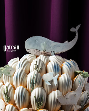 Whale theme madeline tower decorated with adorable ocean creature designs on top