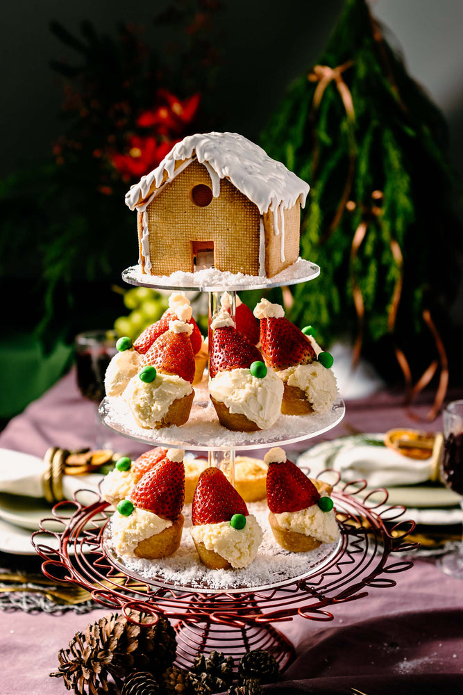 Winter cookies gift tower with gingerbread house and Santa strawberry shortcakes from Gateau Gourmet Cafe